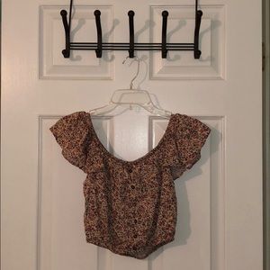 Off the shoulder shirt with buttons.